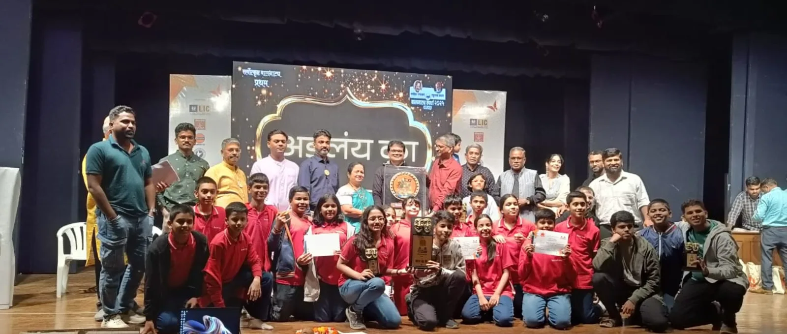 Students and staff at a drama competition awards ceremony