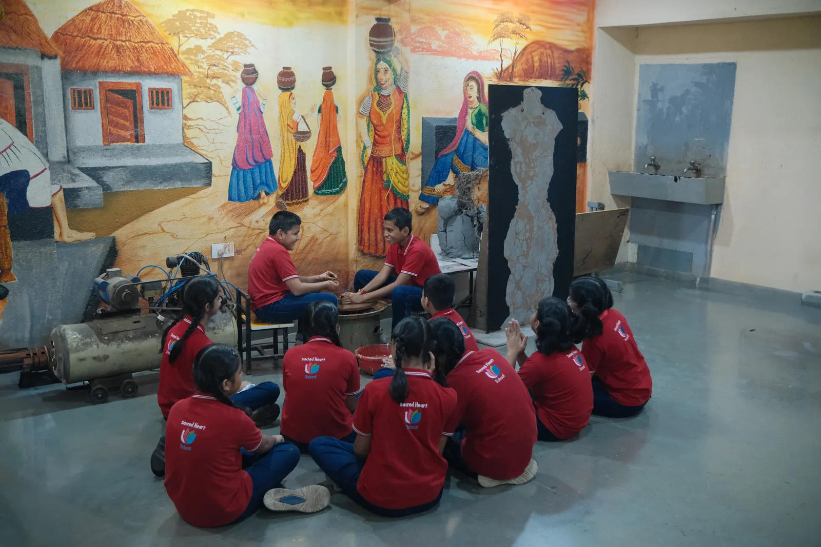 Students working on a mural painting