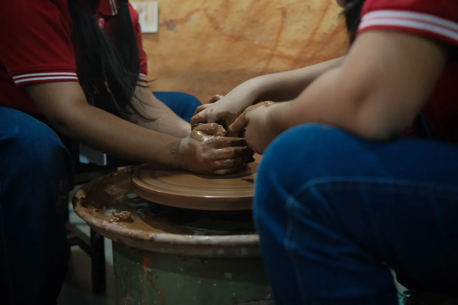 A student at the pottery wheel