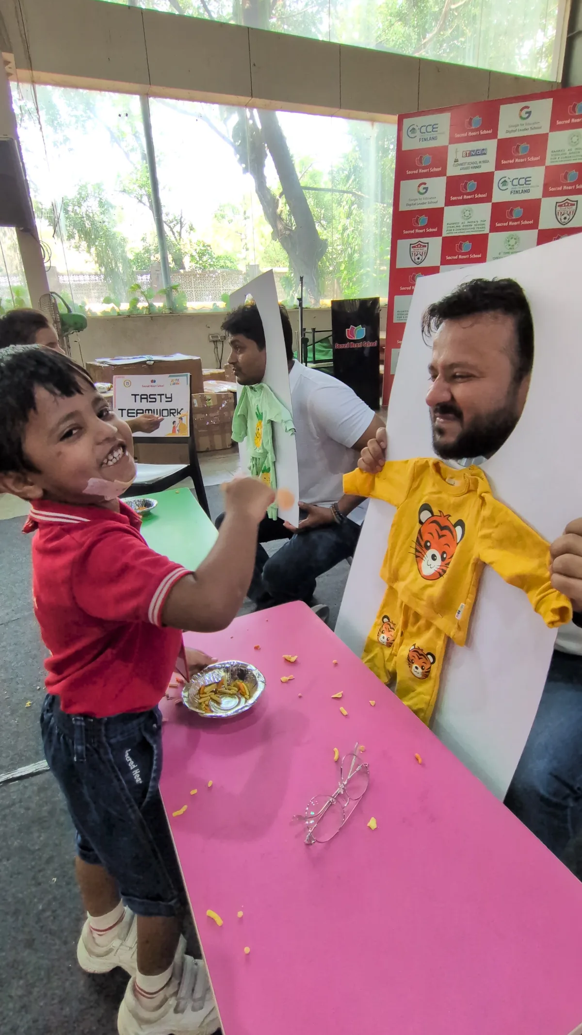 A child and father at a Father's Day craft table