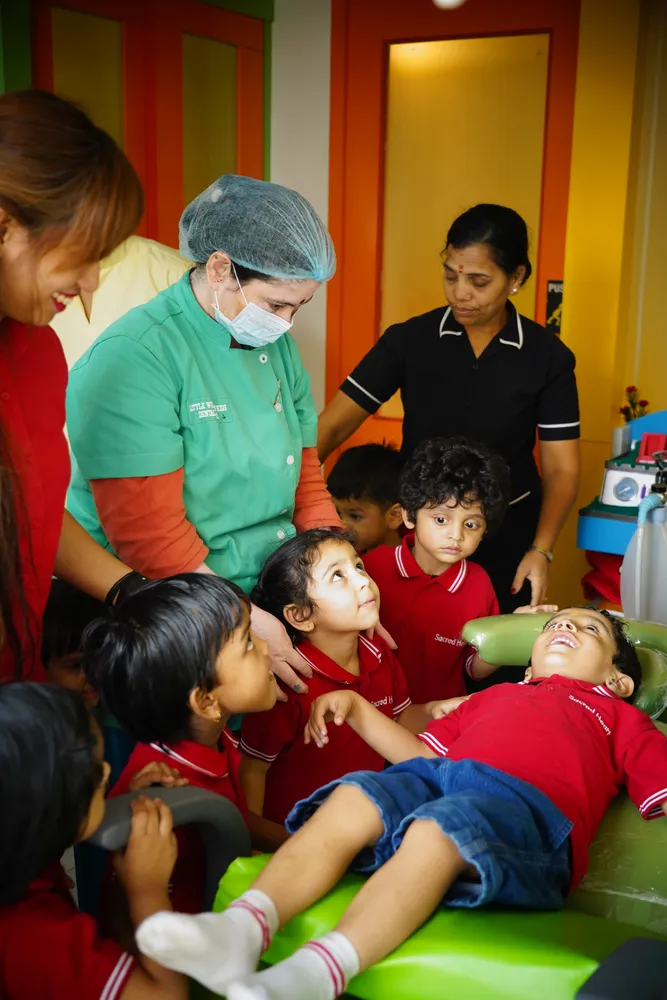 Pre-Primary children watching a dentist at the clinic