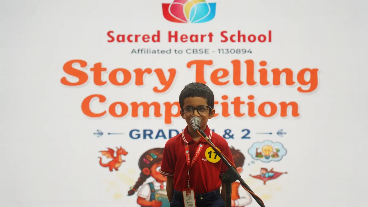 A Primary student speaking into the microphone at the Story Telling Competition