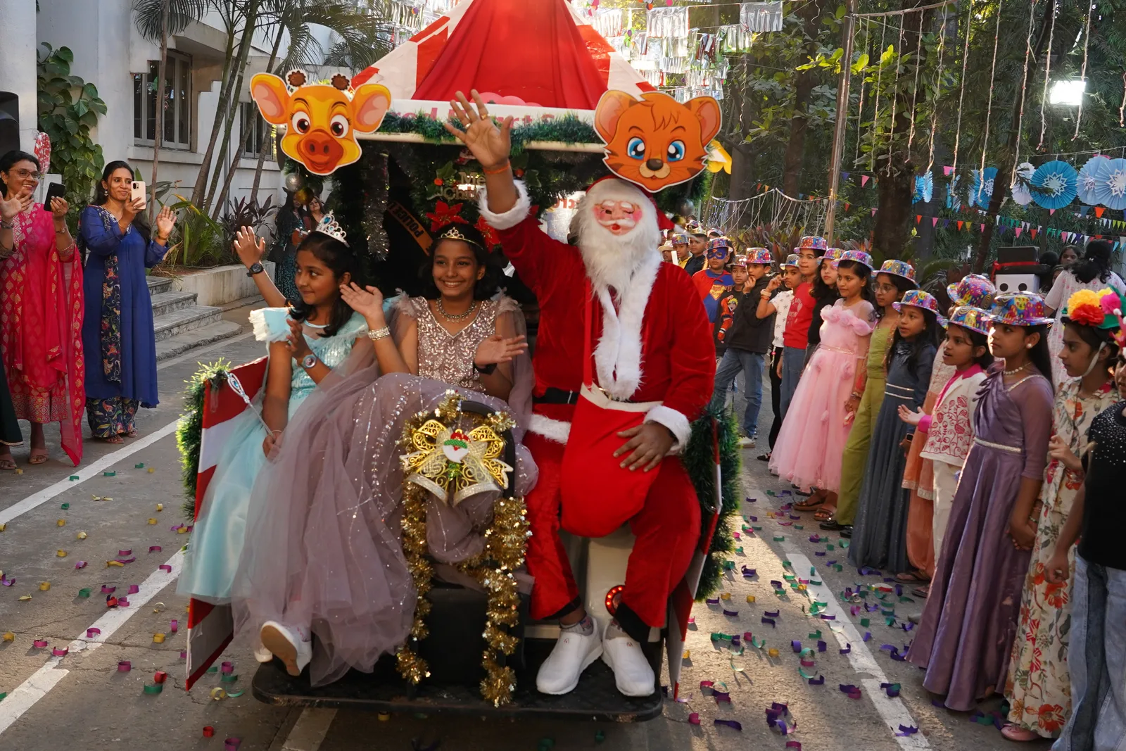 Students in a Christmas parade with Santa