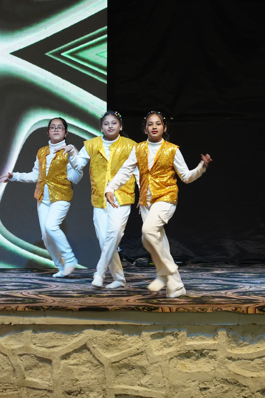 Students performing a dance on stage