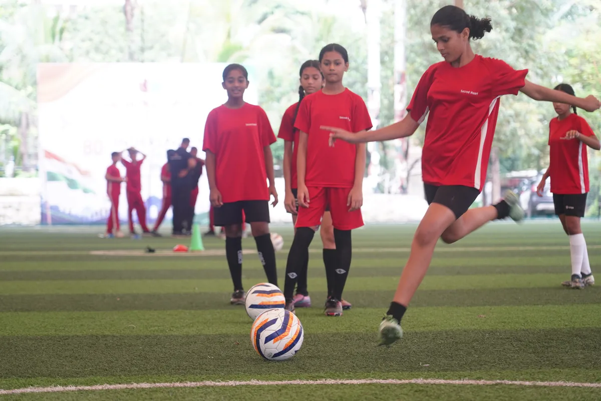 A student practicing football drills